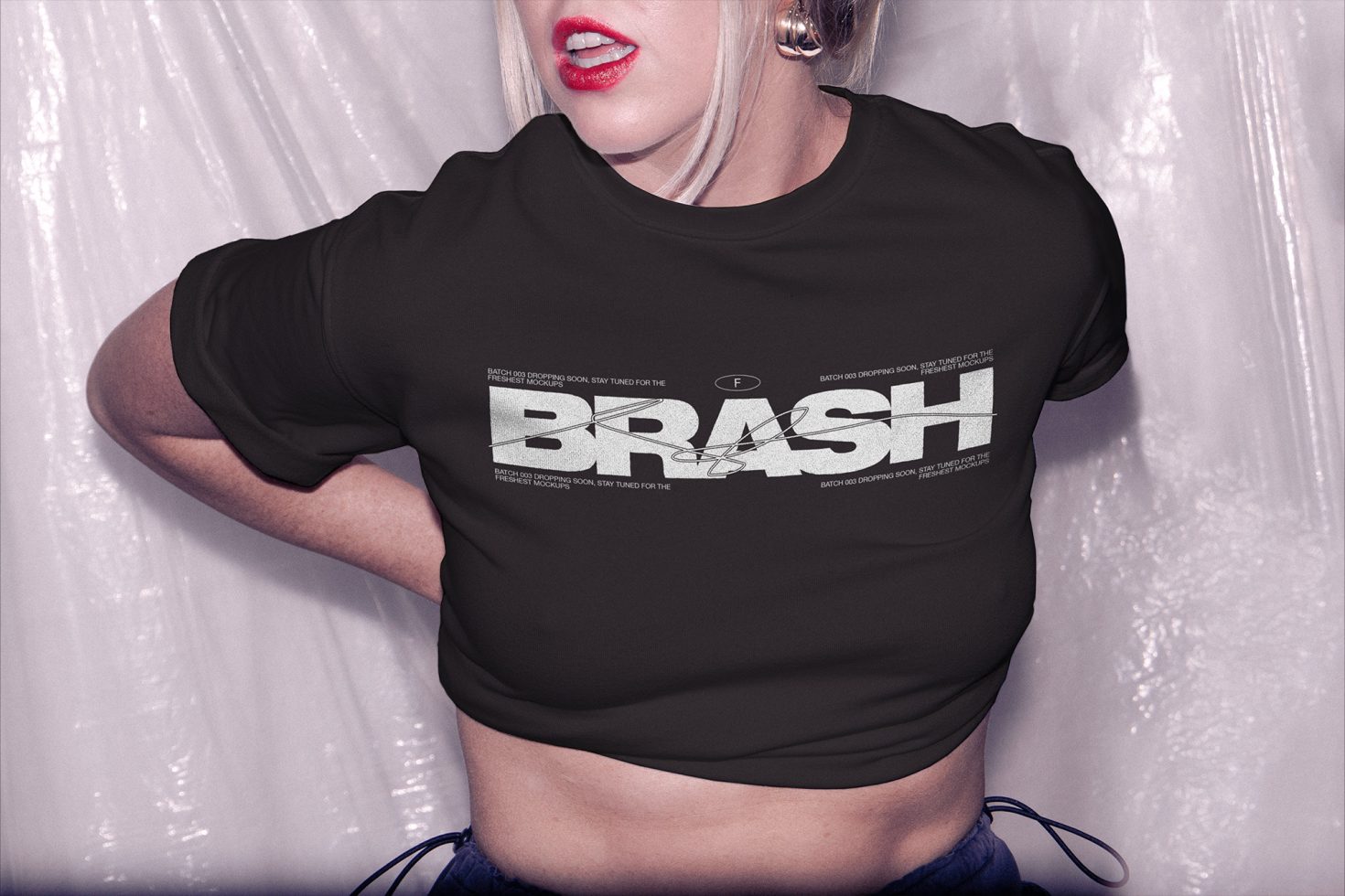 Woman in a cropped black t-shirt mockup with bold white graphic design text, ideal for fashion templates, apparel branding, and designer assets.